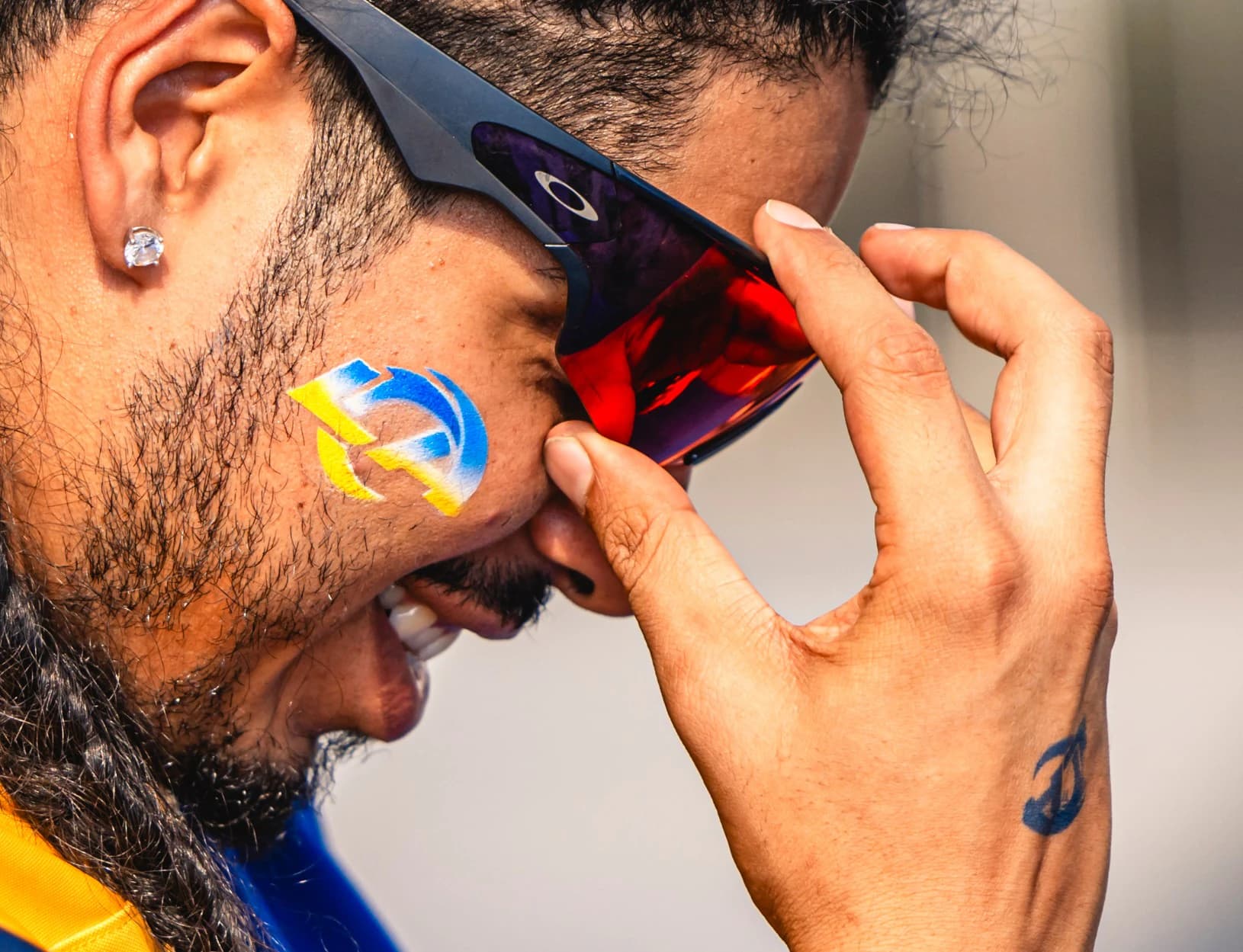 Rams fan with the LA logo painted on his cheek