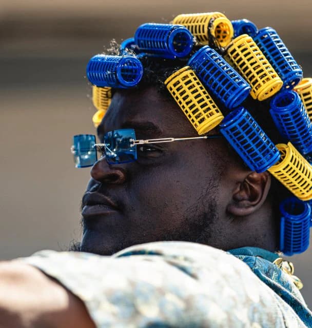 Rams fan in blue and yellow hair curlers