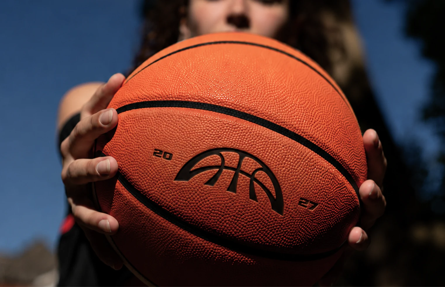 A player holding a Project B basketball