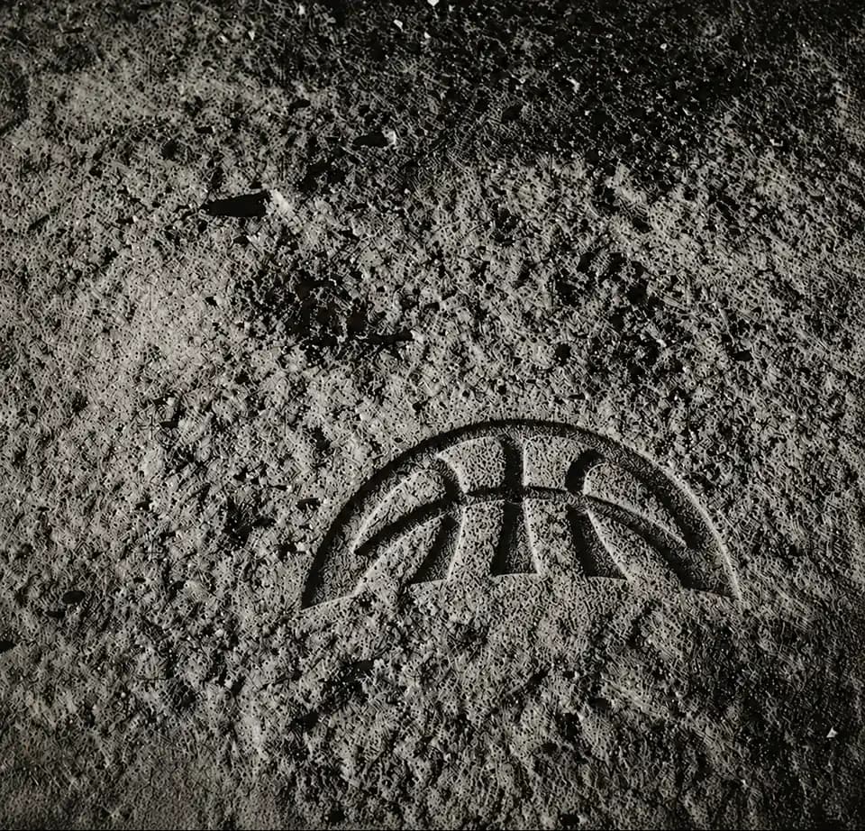 Arc mark pressed into wet concrete