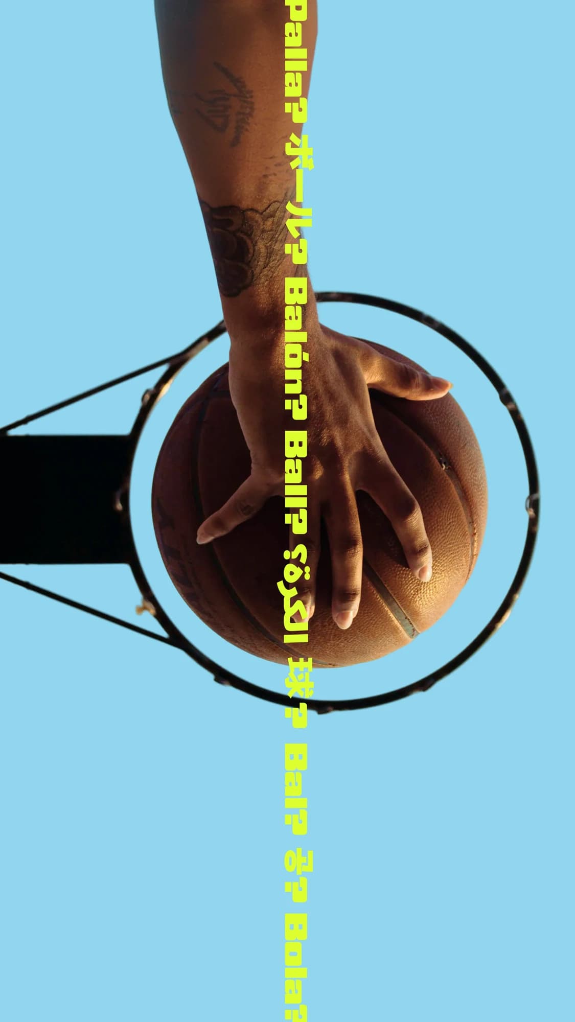 Hand palming a basketball through a hoop, with "Ball?" repeated in many languages